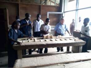 The Don Bosco students learning how to make bricks