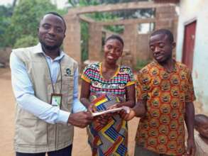 Presenting a cash gift to the couple