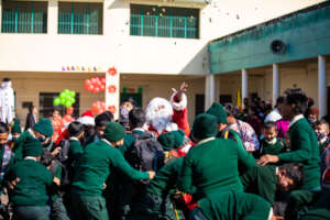 Santa throwing sweets out after the school program
