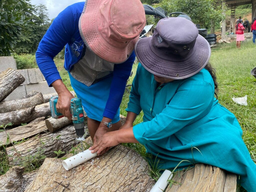 Women build water filters
