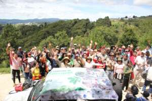 A variety of people celebrating reforestation
