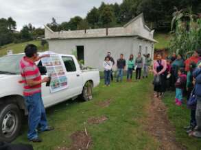 The team explaining how to plant trees