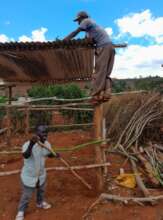Teacher Ben (front) facilitates Mary's project