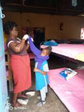 Housemother Susan helping with dressing