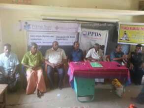 Distribution of note books to the children