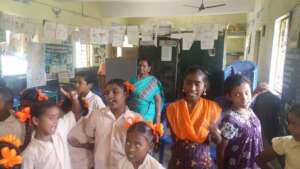 Distribution of note books to the children