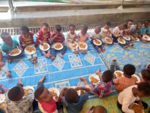 children at MHO enjoying nutritious food