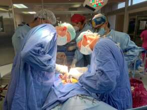 Tiny Jesus under the expert care of surgeons