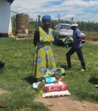 A mother who had just received her food parcel