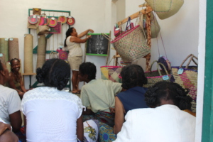 Weavers listening to Paula during a workshop