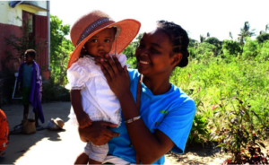 A mother brings her child to the health centre