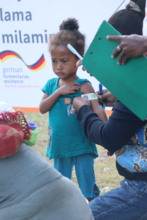 Model Mother learning how to measure her child