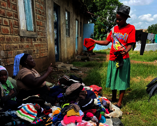 Monicah selling hats