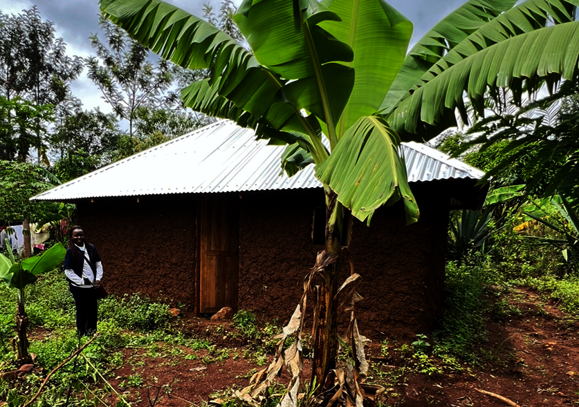 Monicah with her new house