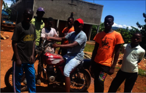 Mechanic Bukenya (seated middle) with his trainees