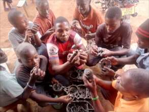Young people learn motorcycle mechanics.