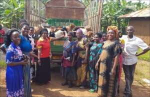 Families in Kyabiiri receive their goats.