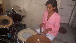 Sheetal playing drums