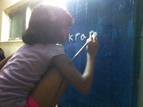 Sumaiya painting on the Kranti home walls