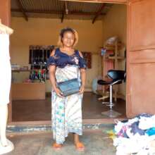Anna at her shop financed by a Microloan