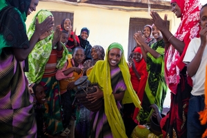 Women celebrating at the milk collection center