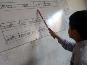 a student reading from the board