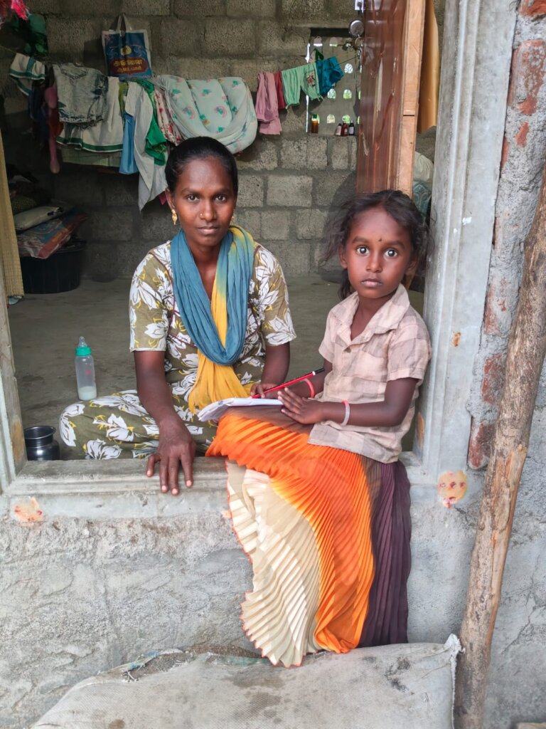 Child with her mother starting to study at home
