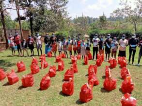 OVC at Ugolwe Center Receiving Food