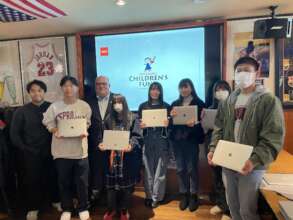 Scholars receiving laptops
