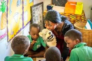 Teacher Ruth engages the children in story telling