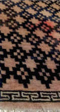 Donated antique E. Tibetan carpet at Gala