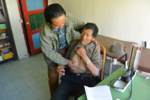 Dr. P treating a patient