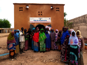 A women groupment behind their storage building