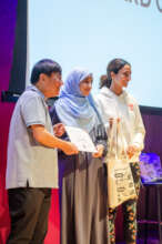 Scholars receiving their certificates.