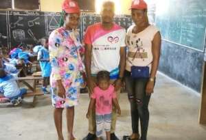 Our team in the class with the child beneficiary