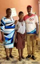 Project Leader with the Headmistress and the child