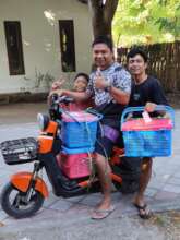 Family picking up their cats after surgeries