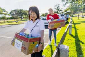 Peace Winds staff and Red Cross volunteer
