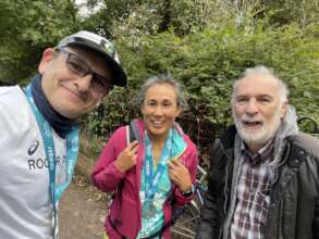 Roger with his friend and brother to cheer him