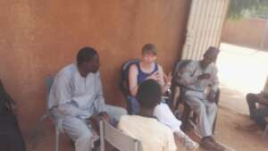 Dr. Gilvin talks with a weaving student