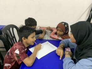 Literacy game time with community volunteer