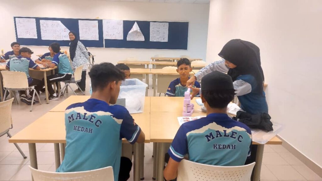 Secondary pilot students participate in a workshop