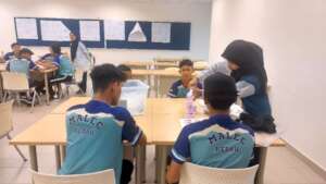 Secondary pilot students participate in a workshop