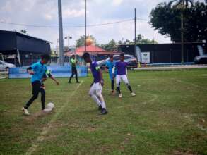RCS Kedah (purple shirt) in action at Faisal Cup
