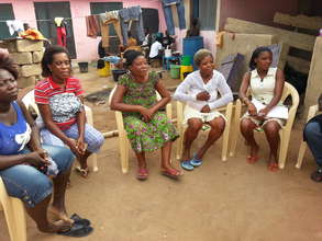 Livelihood Project members discussing repayments