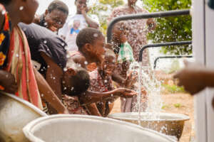 Children celebrating clean water in the community