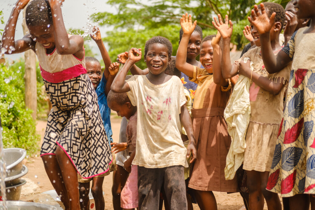 Children rejoice at a Project Maji kiosk in Ghana