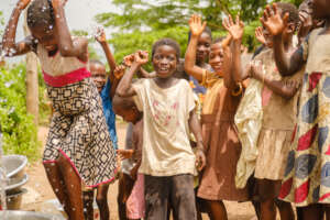 Children rejoice at a Project Maji kiosk in Ghana