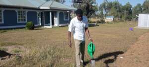 Mr. Oswata tends the garden at the G.A.P. Hub