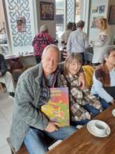 Bruce and his partner with the reminiscence book